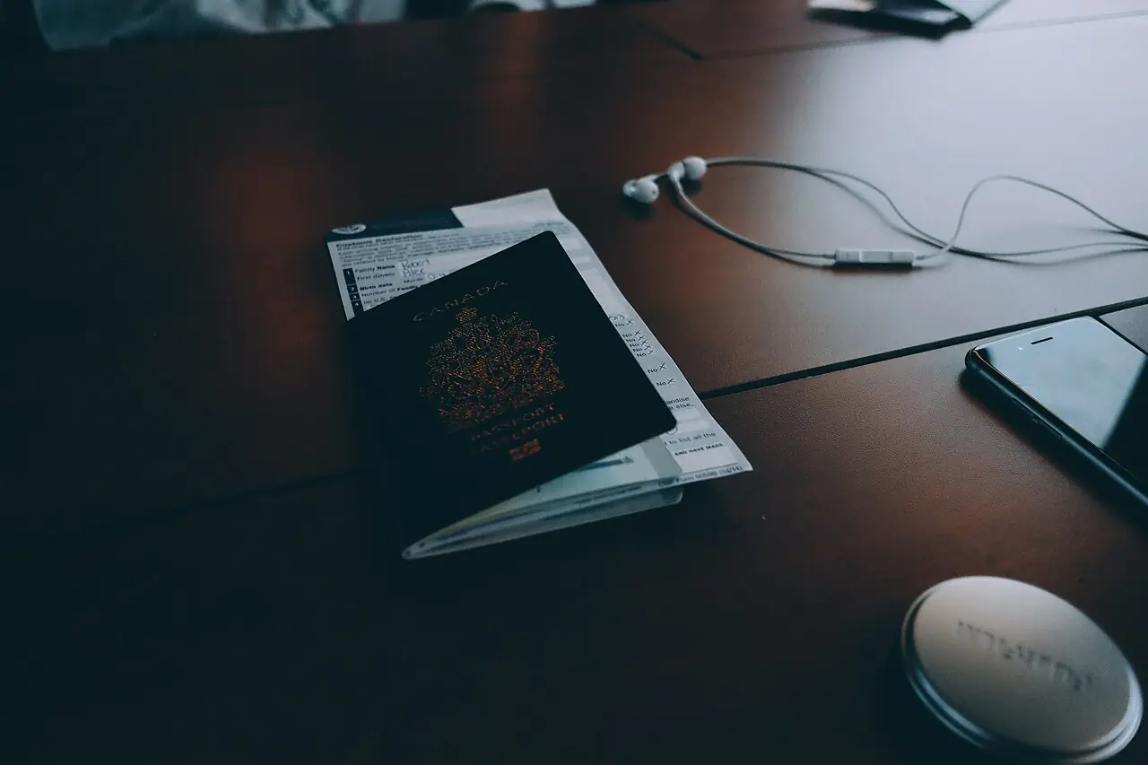 Passport and travel documents on a dark desk